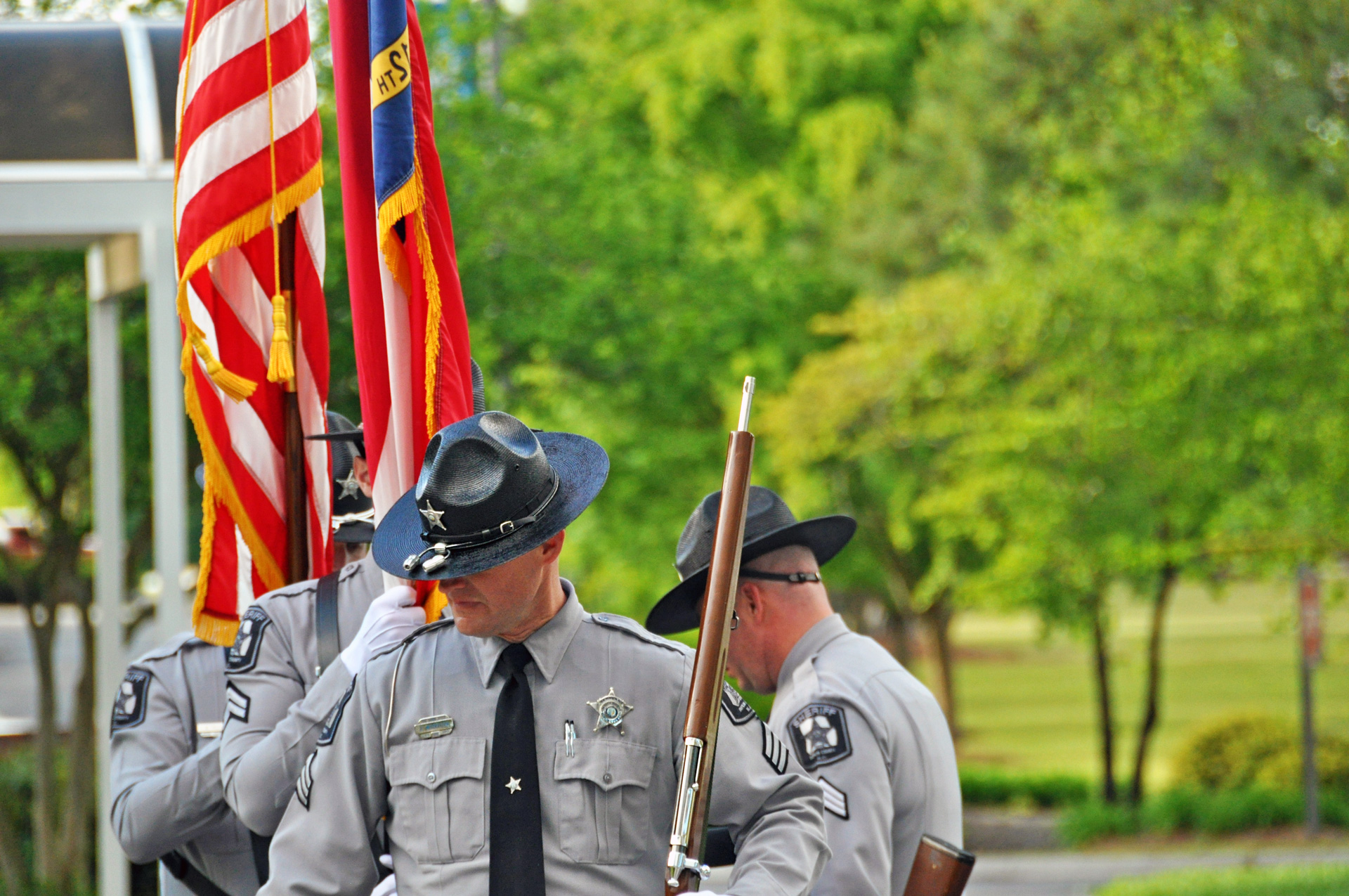 officers-carry-flag-campus-photo-phoenix-creative